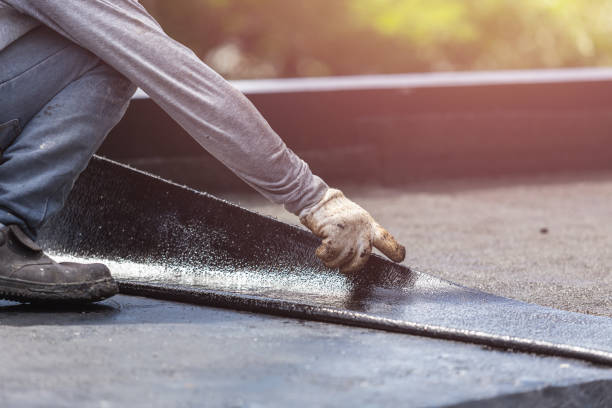 Professional Basement Waterproofing technician working in Viola, IL